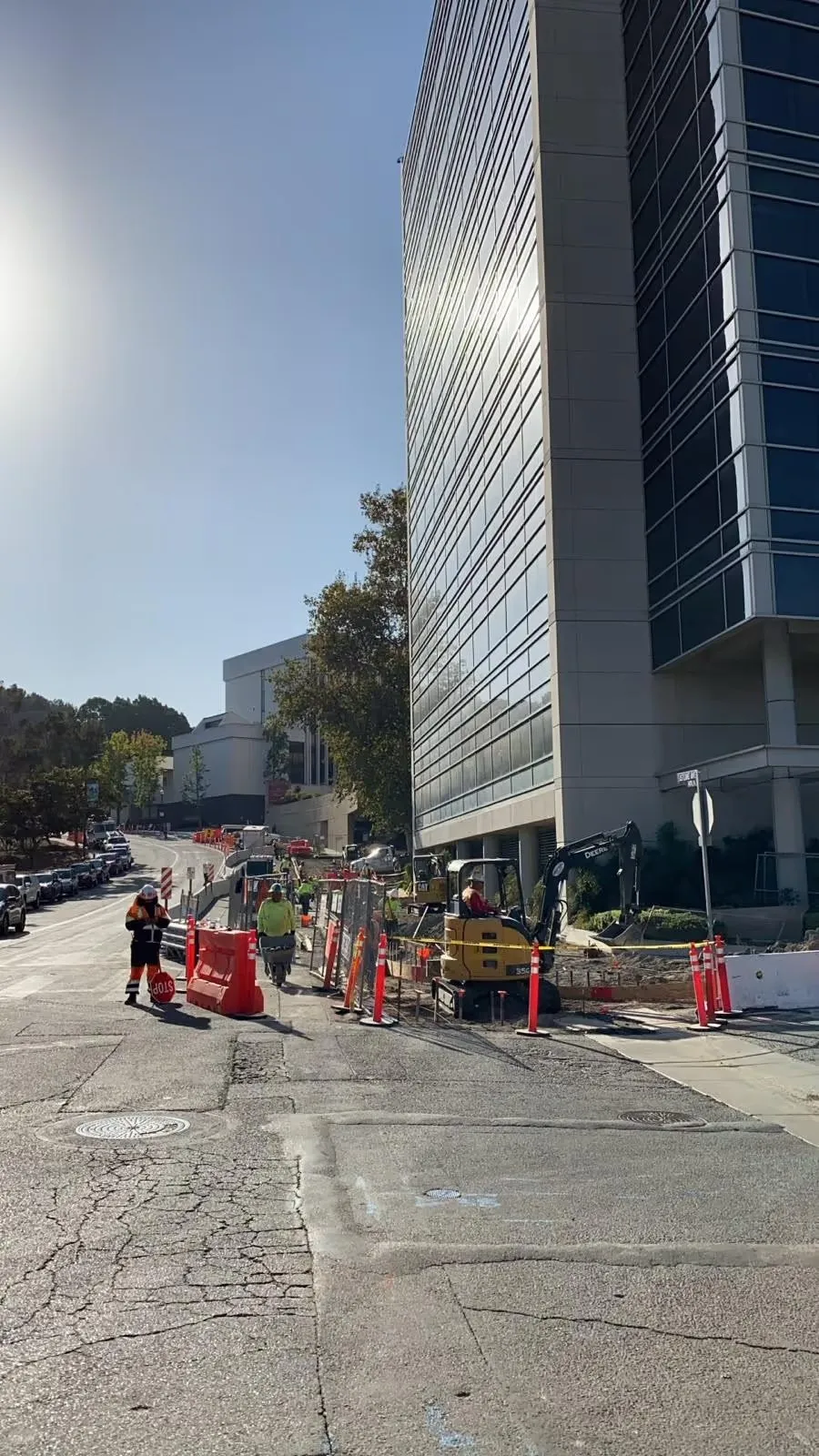 Commercial sidewalk project beside an office tower